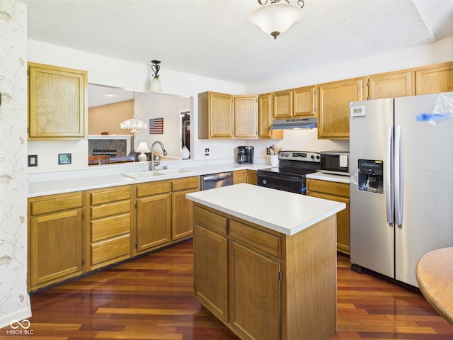 1356 S Catamaran Cir, Cicero, IN 46034 - kitchen with appliances with stainless steel finishes, under cabinet range hood, a sink, dark wood-style floors, and light countertops