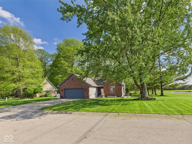 1356 S Catamaran Cir, Cicero, IN 46034 - view of front of property featuring brick siding, asphalt driveway, a front yard, and a garage