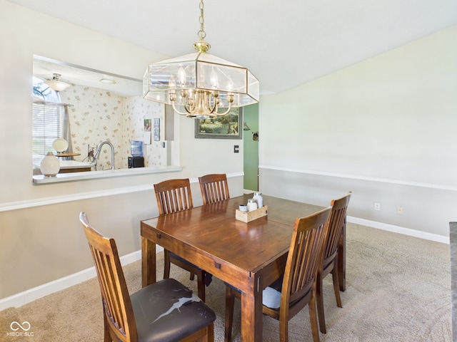 1356 S Catamaran Cir, Cicero, IN 46034 - dining space featuring a chandelier, carpet, and baseboards
