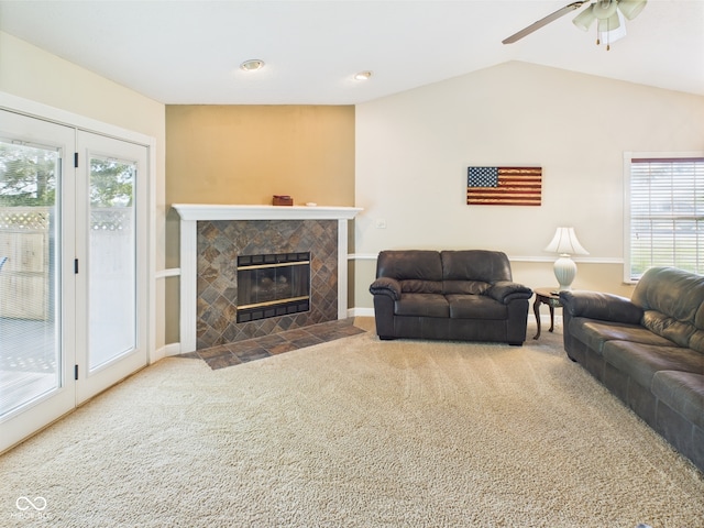1356 S Catamaran Cir, Cicero, IN 46034 - living area featuring carpet floors, a tile fireplace, ceiling fan, and vaulted ceiling