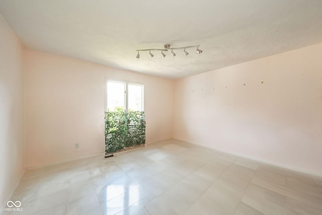 empty room with baseboards
