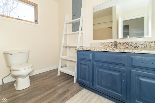 953 S 5th St, Noblesville, IN 46060 - bathroom featuring wood finished floors, baseboards, toilet, and vanity