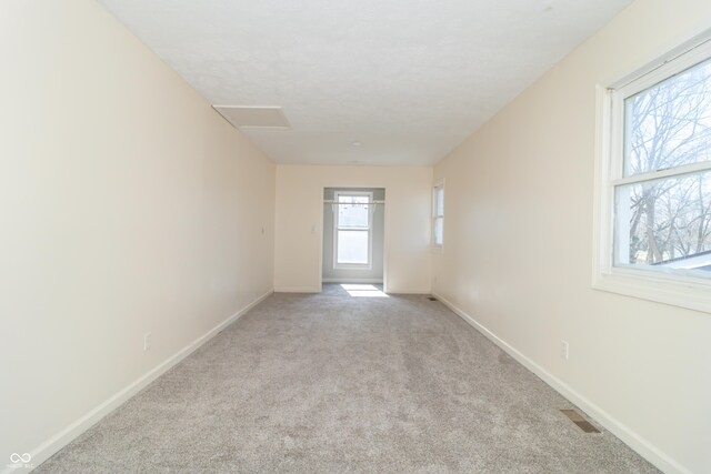 953 S 5th St, Noblesville, IN 46060 - spare room with attic access, light carpet, and baseboards