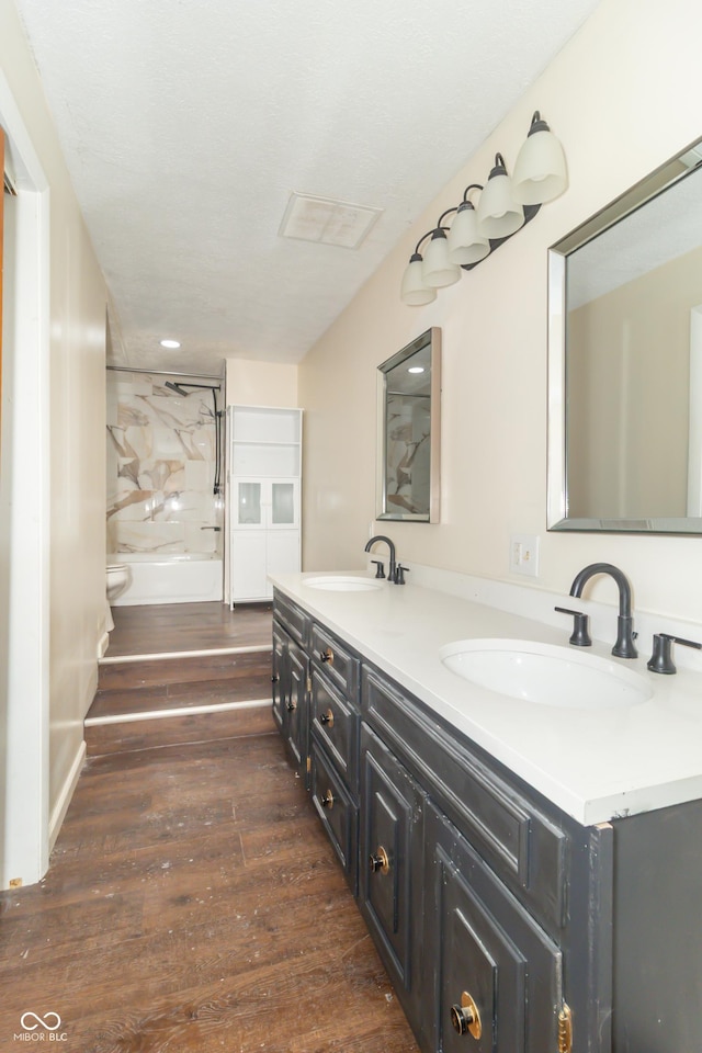 953 S 5th St, Noblesville, IN 46060 - bathroom with double vanity, hardwood / wood-style flooring, toilet, and shower / bath combination