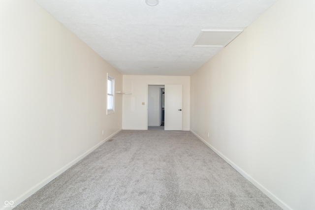 953 S 5th St, Noblesville, IN 46060 - empty room featuring attic access, carpet floors, and baseboards