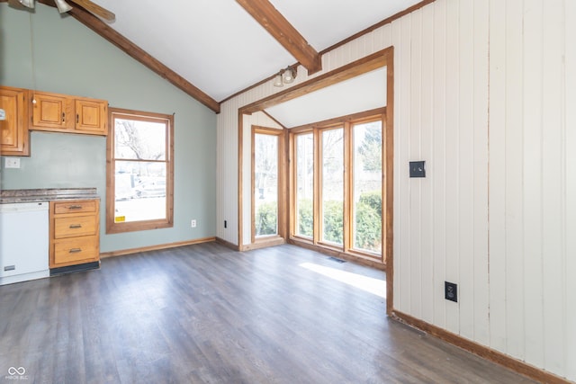 953 S 5th St, Noblesville, IN 46060 - unfurnished living room featuring dark wood-style floors, baseboards, a ceiling fan, and wood walls