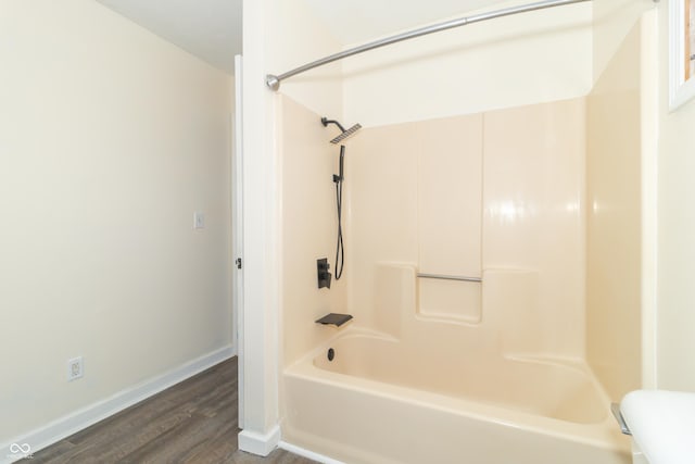 953 S 5th St, Noblesville, IN 46060 - full bathroom with wood finished floors, baseboards, bathtub / shower combination, and toilet