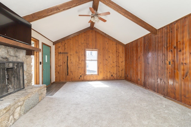 953 S 5th St, Noblesville, IN 46060 - unfurnished living room featuring a ceiling fan, wood walls, a fireplace, and carpet floors