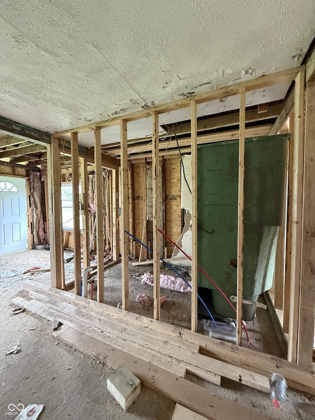 miscellaneous room with a textured ceiling