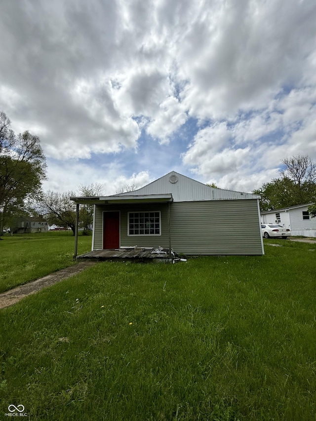 back of property with a yard