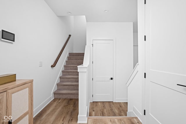 127 Monon Green Blvd, Carmel, IN 46032 - staircase with wood finished floors and baseboards