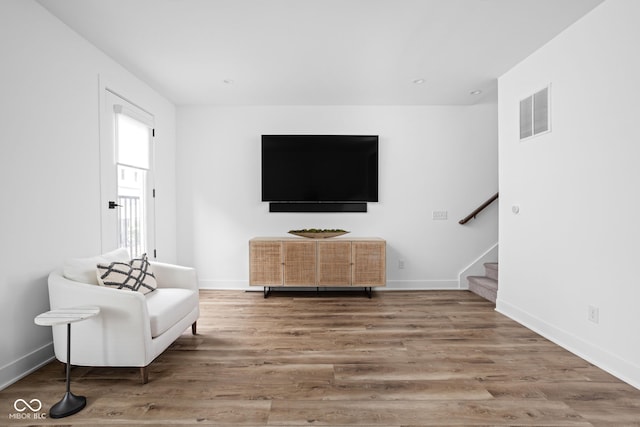 127 Monon Green Blvd, Carmel, IN 46032 - sitting room with stairway and wood finished floors