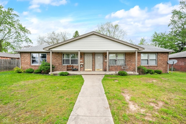 5120 Apache Ct, Columbus, IN 47203 - ranch-style home with brick siding, a porch, and roof with shingles