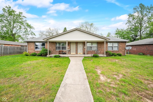 5120 Apache Ct, Columbus, IN 47203 - view of front facade featuring covered porch and brick siding