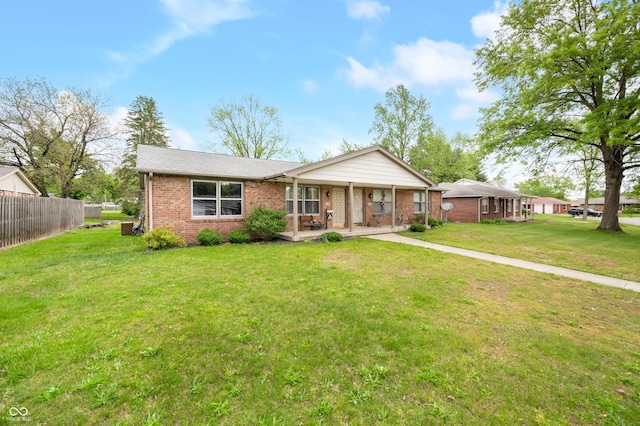 5120 Apache Ct, Columbus, IN 47203 - ranch-style home with brick siding and a porch