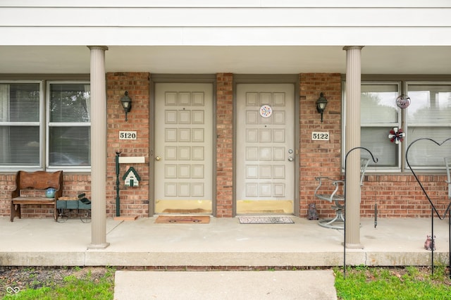 5120 Apache Ct, Columbus, IN 47203 - entrance to property with a porch and brick siding