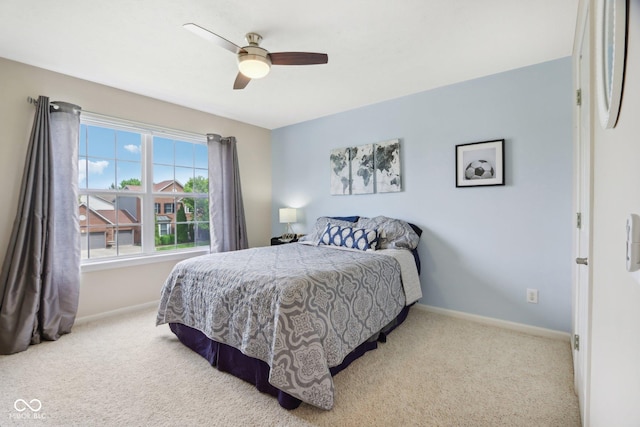 bedroom with baseboards, carpet flooring, and a ceiling fan