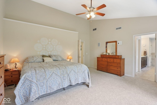 carpeted bedroom featuring vaulted ceiling, a ceiling fan, and baseboards