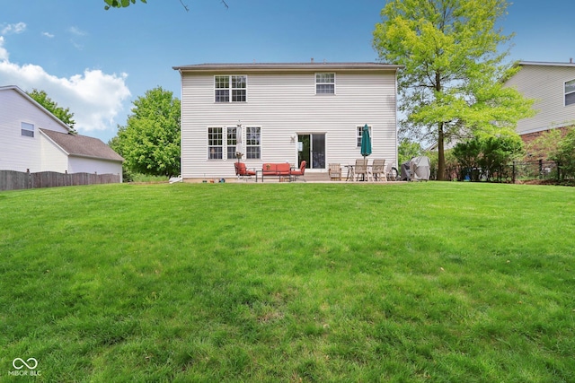 back of property with a patio