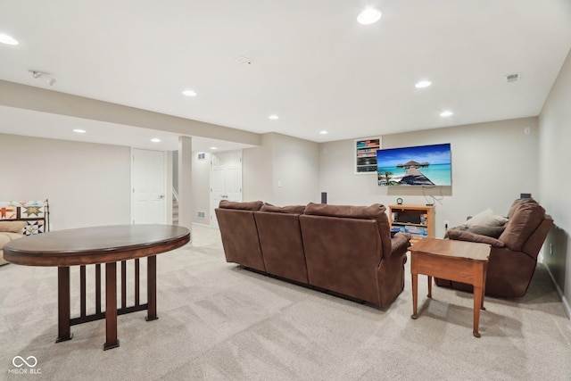living room featuring light colored carpet, recessed lighting, and stairway