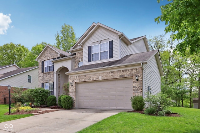 traditional-style home with driveway, a garage, brick siding, a front yard, and roof with shingles