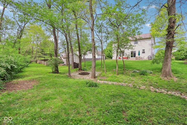 view of yard with an outdoor fire pit