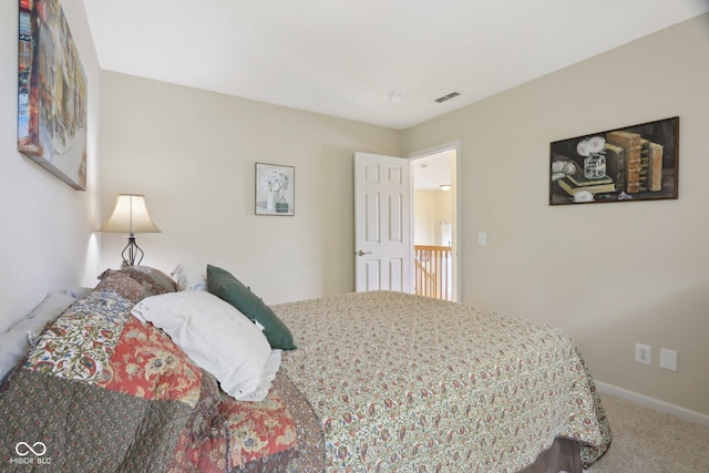 bedroom with carpet flooring and baseboards
