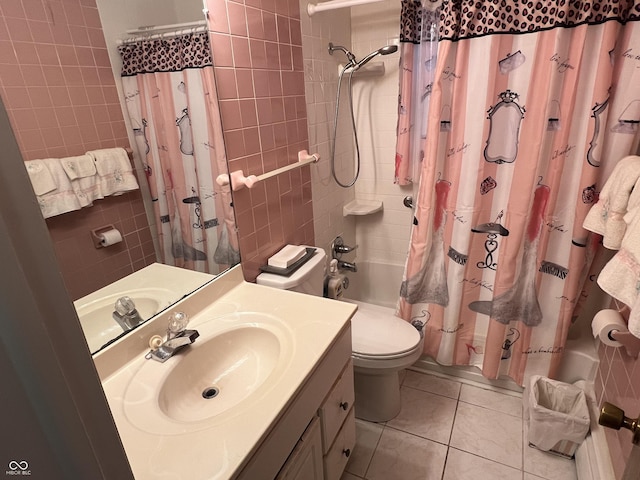 2927 E 8th St, Anderson, IN 46012 - full bathroom featuring tile patterned floors, shower / bathtub combination with curtain, toilet, vanity, and tile walls