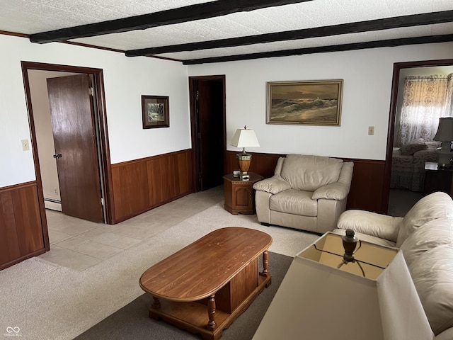 2927 E 8th St, Anderson, IN 46012 - living area featuring a wainscoted wall, a baseboard heating unit, wood walls, light carpet, and beam ceiling