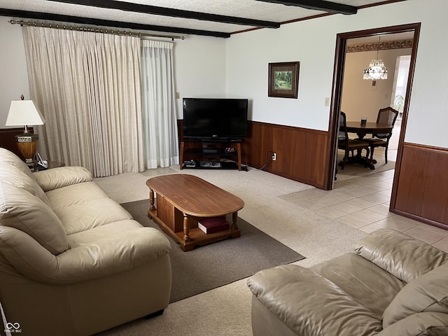 2927 E 8th St, Anderson, IN 46012 - living room with a chandelier, a wainscoted wall, and wooden walls