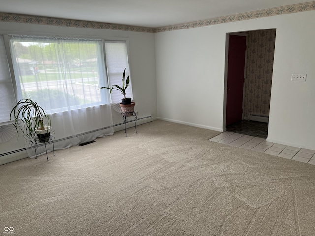 2927 E 8th St, Anderson, IN 46012 - carpeted spare room featuring a baseboard radiator and a baseboard heating unit