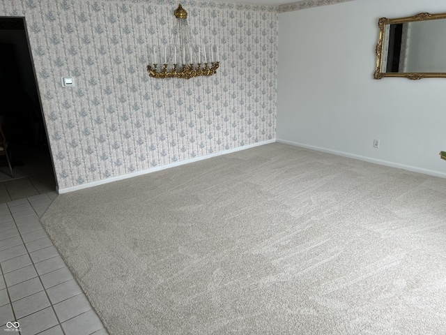 2927 E 8th St, Anderson, IN 46012 - spare room with baseboards, tile patterned flooring, and wallpapered walls