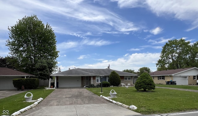2927 E 8th St, Anderson, IN 46012 - single story home with driveway, a front yard, and an attached garage