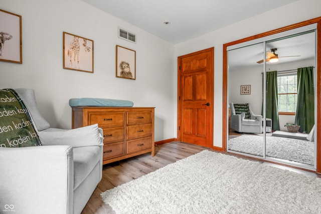 living area with light wood-style floors and baseboards