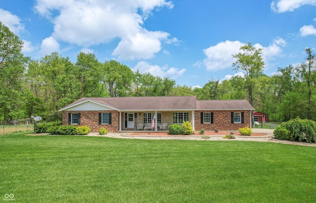 ranch-style home featuring a porch and brick siding