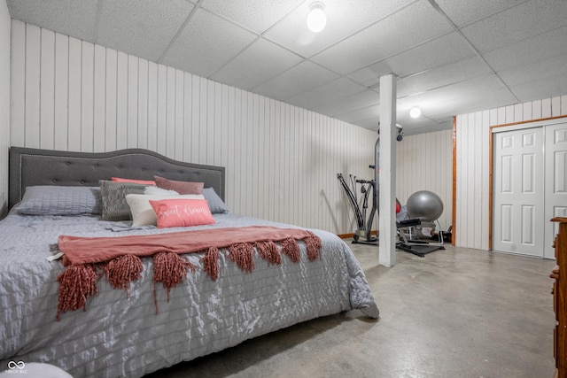 bedroom featuring finished concrete flooring