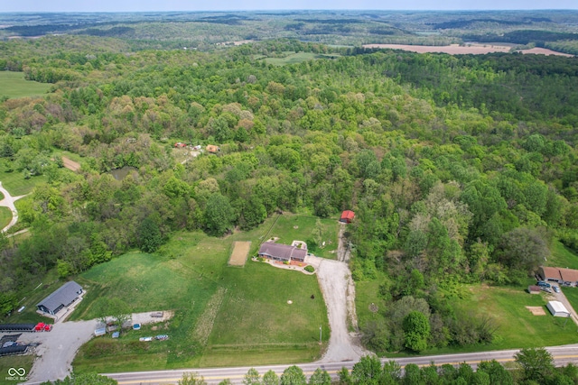 aerial overview of property's location featuring a forest