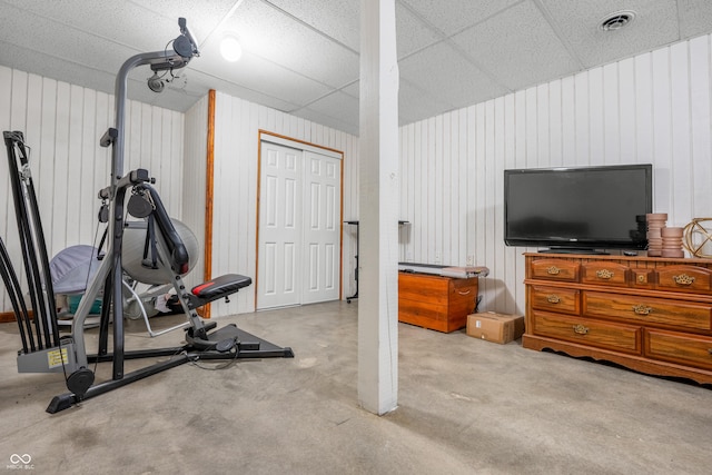 exercise area featuring wooden walls