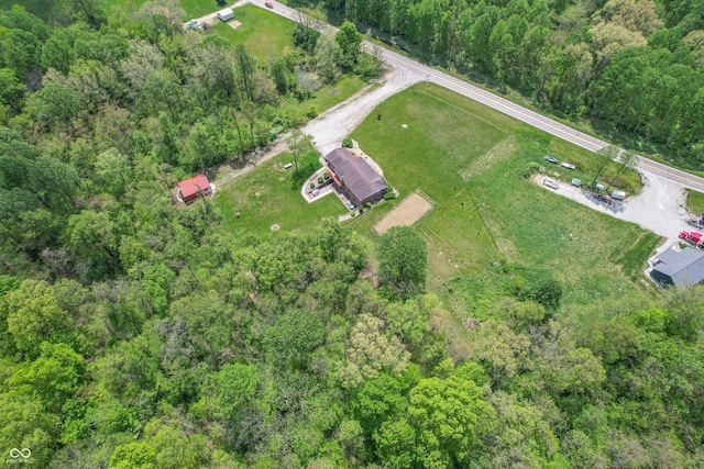 aerial view of property's location with a heavily wooded area