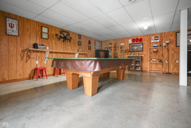 recreation room with wood walls, billiards table, baseboards, and a drop ceiling