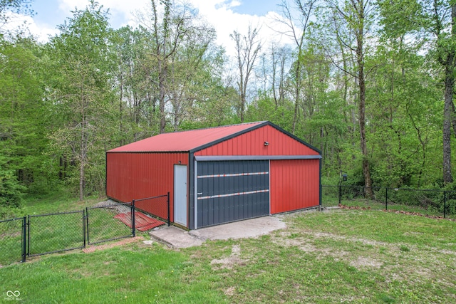 detached garage featuring a gate