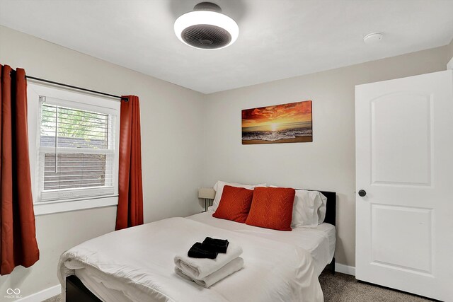 carpeted bedroom with baseboards
