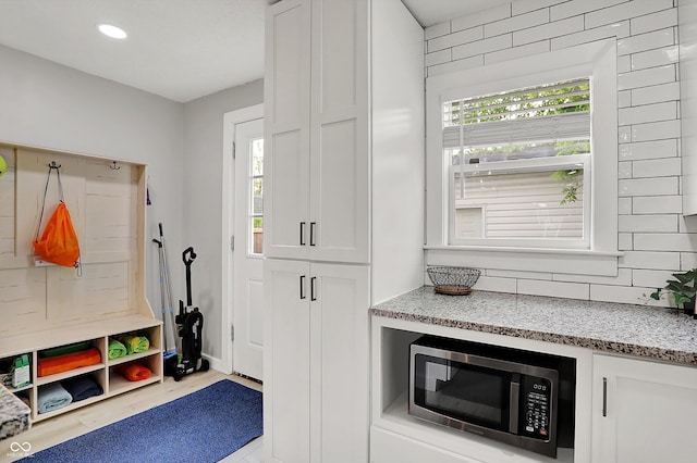 mudroom with wood finished floors