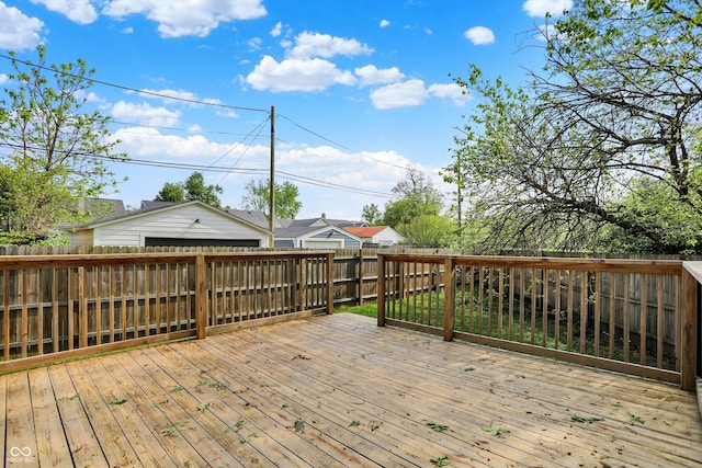 deck featuring a fenced backyard and a detached garage