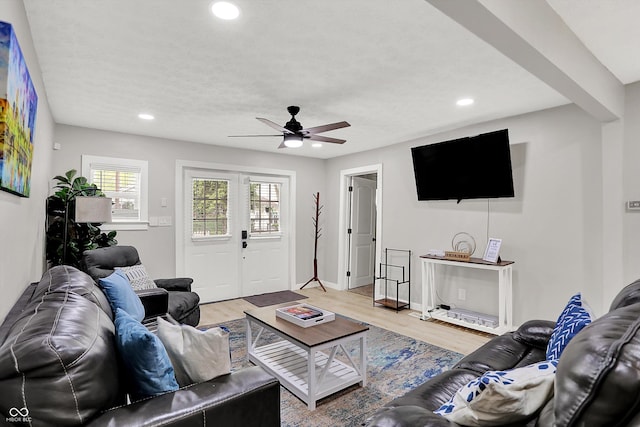living room with a ceiling fan, recessed lighting, wood finished floors, and baseboards