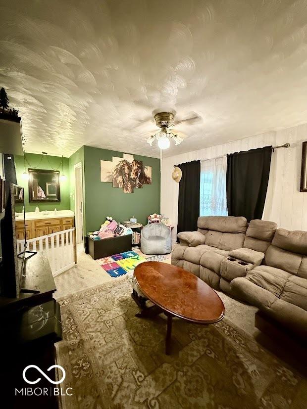 living room with ceiling fan