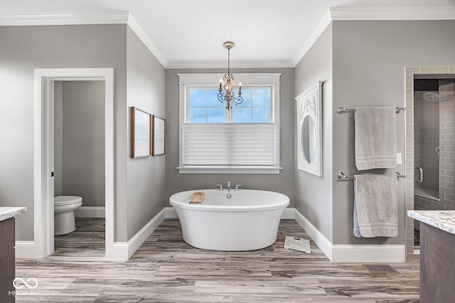629 Perry Ln, West Lafayette, IN 47906 - bathroom featuring ornamental molding, baseboards, wood finished floors, and a chandelier