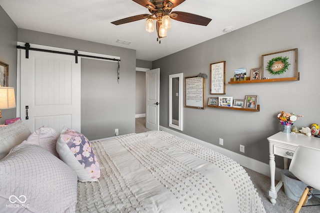 629 Perry Ln, West Lafayette, IN 47906 - carpeted bedroom featuring a closet, baseboards, a barn door, and ceiling fan