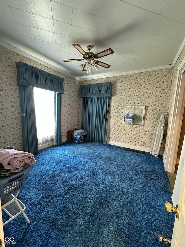 803 W 12th St, Anderson, IN 46016 - unfurnished living room with ornamental molding, carpet flooring, ceiling fan, and wallpapered walls
