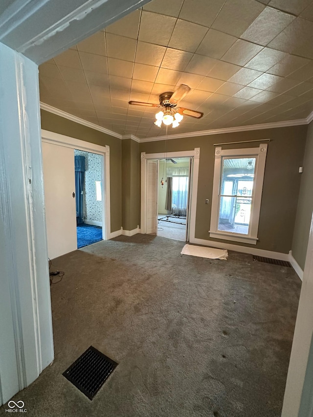 803 W 12th St, Anderson, IN 46016 - unfurnished living room featuring carpet flooring, crown molding, ceiling fan, and baseboards